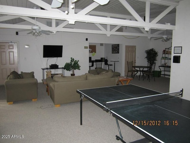 recreation room featuring a ceiling fan, beam ceiling, and high vaulted ceiling