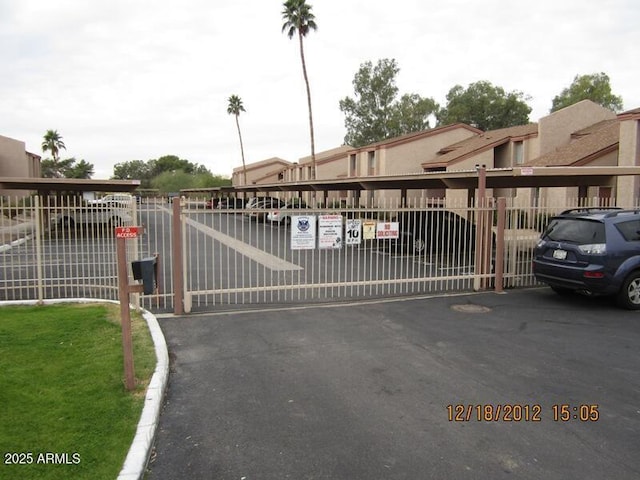 view of gate with fence