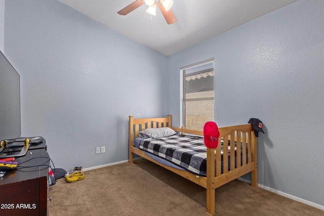 bedroom with ceiling fan, carpet, and lofted ceiling