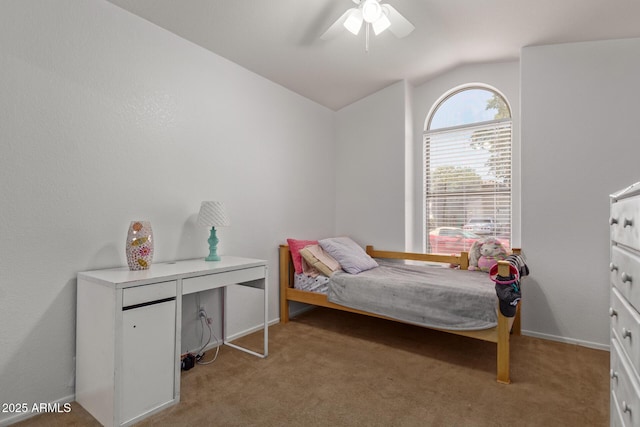 carpeted bedroom with ceiling fan and lofted ceiling