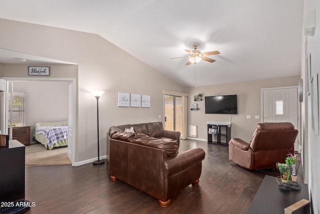 living room with ceiling fan, a wealth of natural light, dark hardwood / wood-style floors, and vaulted ceiling