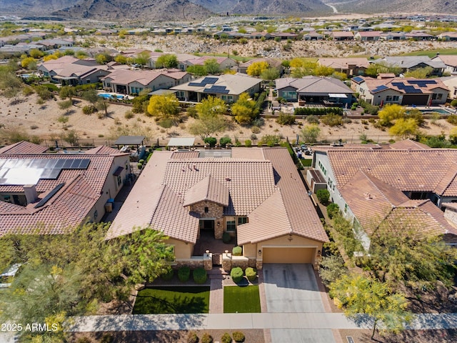 birds eye view of property with a mountain view and a residential view
