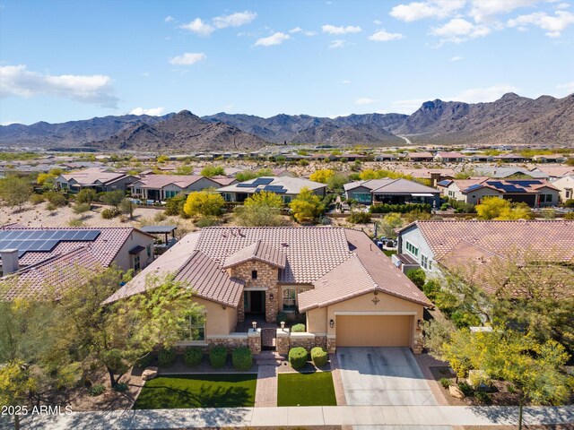 drone / aerial view with a residential view and a mountain view
