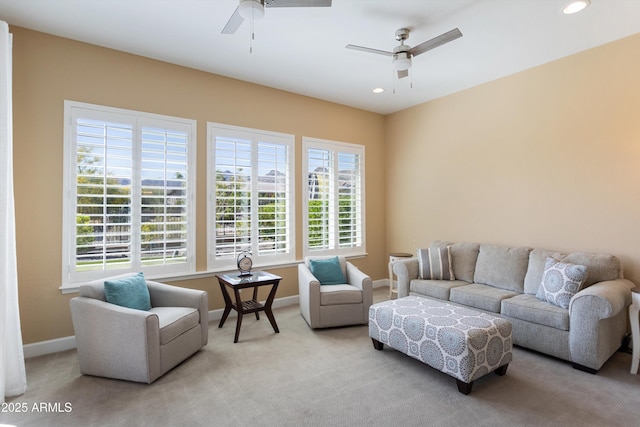 living area featuring recessed lighting, carpet, baseboards, and a ceiling fan