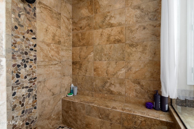 room details featuring a tile shower