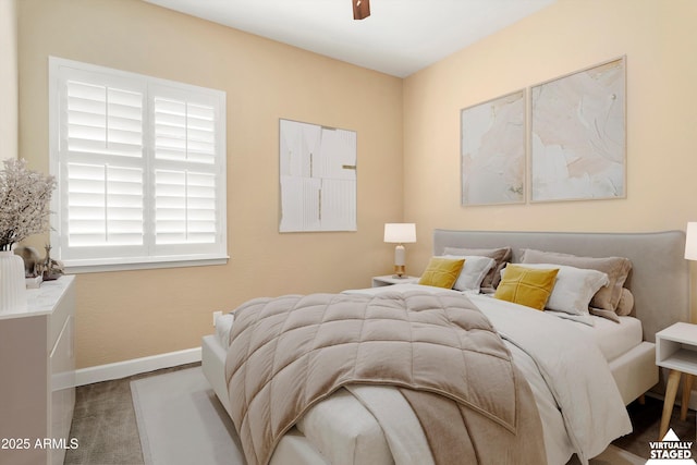 bedroom with baseboards and carpet floors
