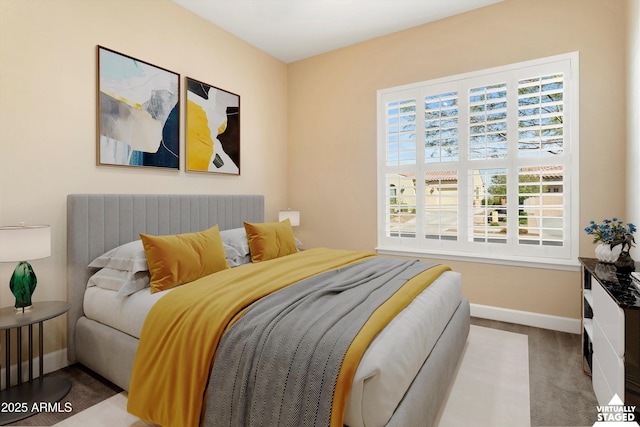 bedroom featuring carpet flooring and baseboards