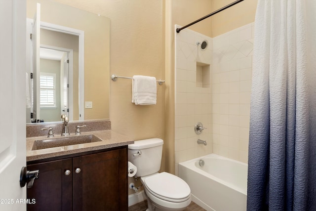 bathroom with toilet, shower / bath combo, and vanity