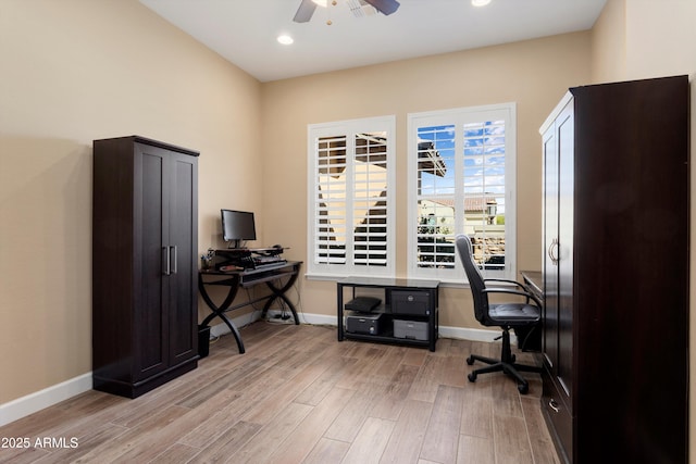 office space with light wood finished floors, baseboards, a ceiling fan, and recessed lighting
