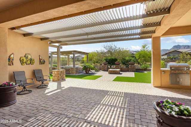 view of patio / terrace featuring area for grilling, a pergola, and fence