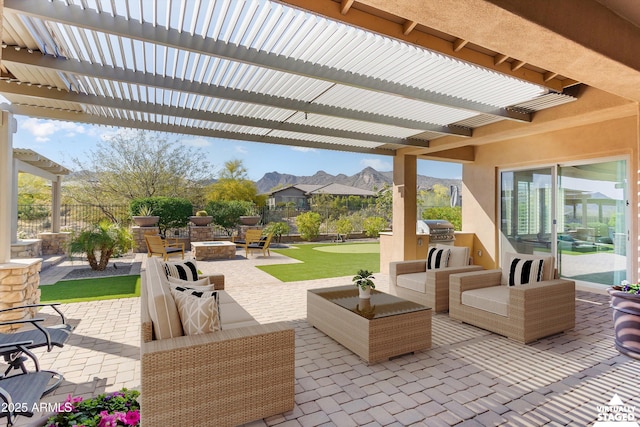 view of patio / terrace with a pergola, an outdoor living space, fence, and a mountain view