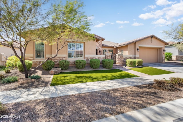 mediterranean / spanish-style house featuring driveway, a garage, stucco siding, and stone siding