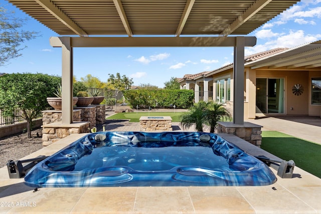view of patio with a jacuzzi, a pergola, and fence