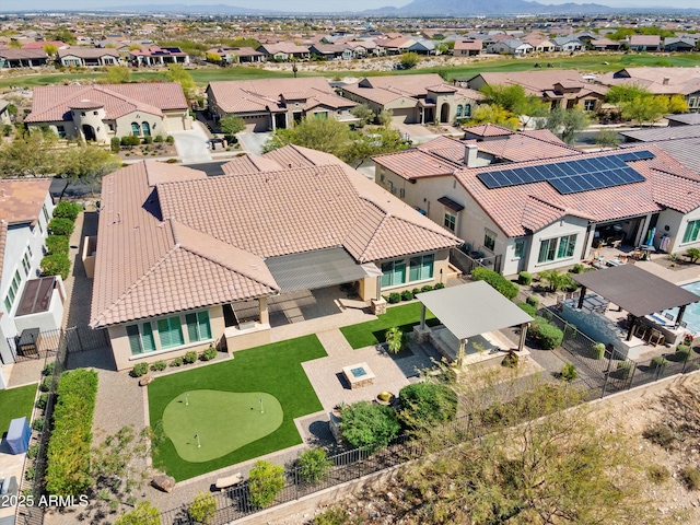 birds eye view of property featuring a mountain view and a residential view