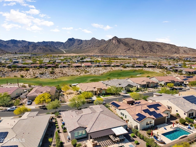 drone / aerial view featuring a mountain view, a residential view, and view of golf course