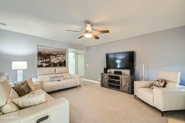 living room with ceiling fan and light colored carpet