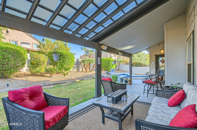 view of patio with an outdoor living space with a fire pit