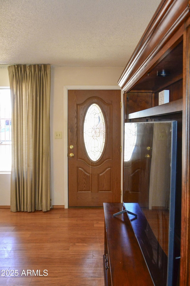 3519 W Libby St, Glendale, AZ 85308 - entryway featuring a textured ceiling and wood finished floors