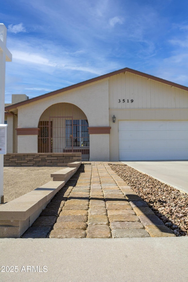 3519 W Libby St, Glendale, AZ 85308 - view of front facade featuring an attached garage, concrete driveway, and stucco siding