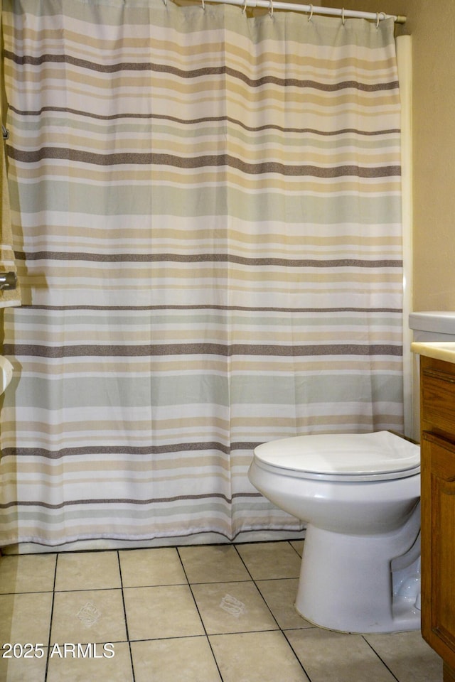 3519 W Libby St, Glendale, AZ 85308 - bathroom with toilet, tile patterned floors, and vanity