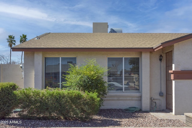 3519 W Libby St, Glendale, AZ 85308 - view of side of property featuring stucco siding and roof with shingles