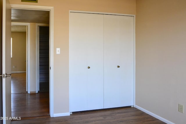 3519 W Libby St, Glendale, AZ 85308 - unfurnished bedroom with dark wood-type flooring, a closet, and baseboards