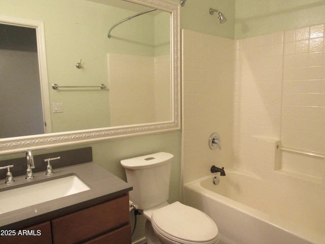 bathroom featuring  shower combination, vanity, and toilet