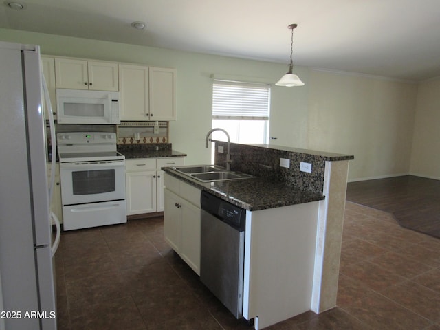 kitchen with white appliances, white cabinetry, a sink, and decorative backsplash