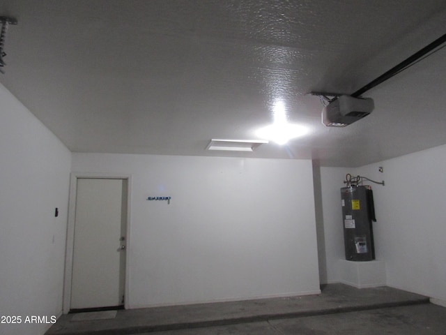 garage featuring water heater and a garage door opener