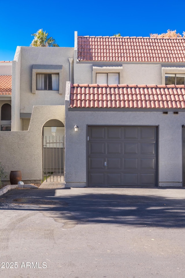 view of front of property with a garage