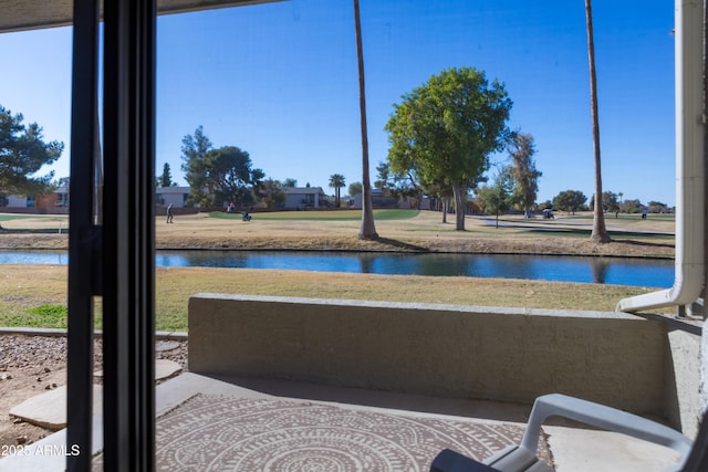 sunroom / solarium with a water view