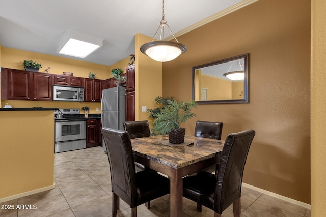 5335 E Shea Blvd Unit 1094, Scottsdale, AZ 85254 - dining room with light tile patterned floors, baseboards, and ornamental molding