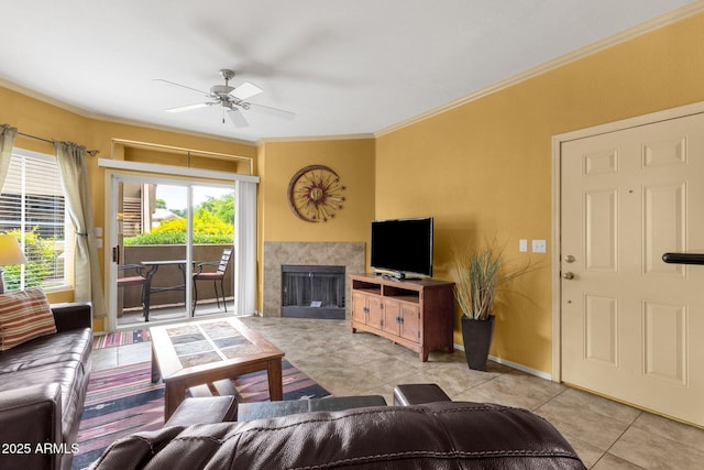 5335 E Shea Blvd Unit 1094, Scottsdale, AZ 85254 - living area featuring tile patterned floors, a ceiling fan, ornamental molding, and a fireplace