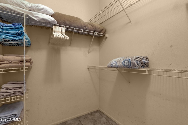 5335 E Shea Blvd Unit 1094, Scottsdale, AZ 85254 - walk in closet featuring tile patterned flooring