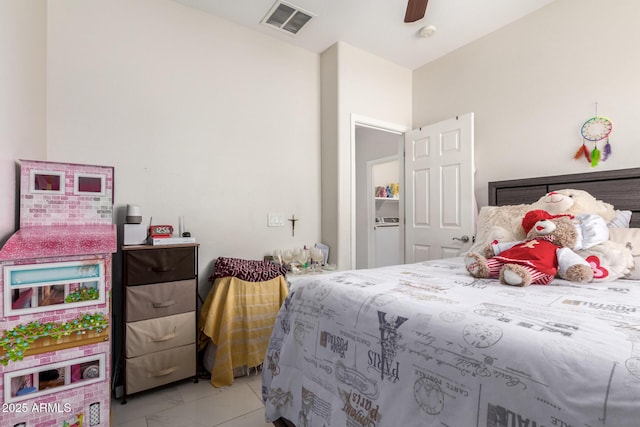 205 N 107th Dr, Avondale, AZ 85323 - bedroom with light marble finish floors and ceiling fan