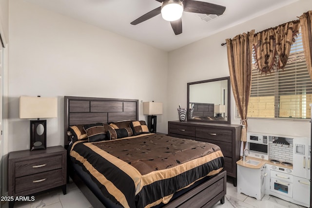 205 N 107th Dr, Avondale, AZ 85323 - bedroom featuring light marble finish flooring and ceiling fan