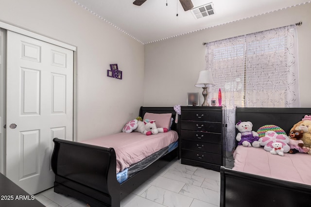 205 N 107th Dr, Avondale, AZ 85323 - bedroom featuring light marble finish flooring and a ceiling fan
