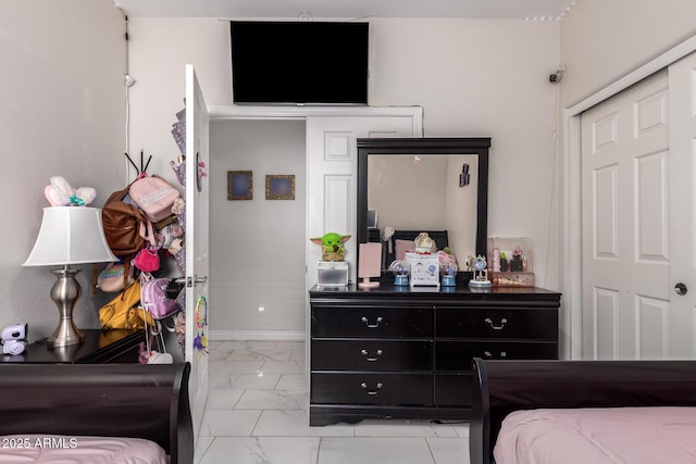 205 N 107th Dr, Avondale, AZ 85323 - bedroom featuring light marble finish floors and baseboards
