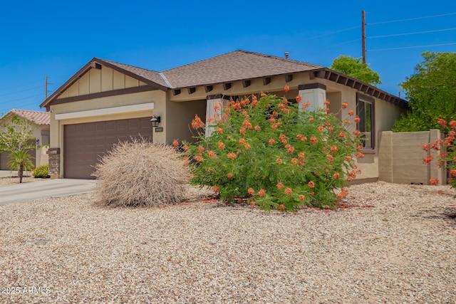 205 N 107th Dr, Avondale, AZ 85323 - view of front of house featuring a garage, driveway, and stucco siding