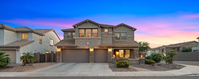 view of front of home featuring fence, stucco siding, an attached garage, driveway, and a porch