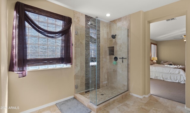 bathroom featuring visible vents, a stall shower, ceiling fan, and ensuite bath