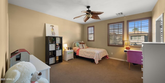 bedroom with carpet floors, baseboards, visible vents, and ceiling fan