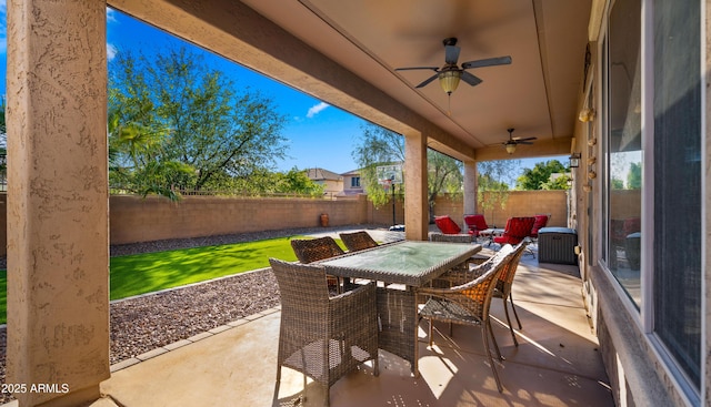 view of patio / terrace with a ceiling fan, a fenced backyard, and outdoor dining space