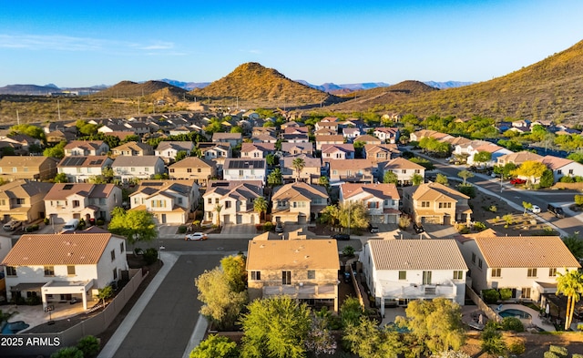 birds eye view of property with a residential view and a mountain view