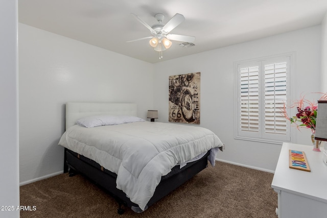 carpeted bedroom featuring visible vents, a ceiling fan, and baseboards