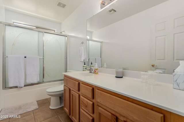 bathroom featuring tile patterned floors, visible vents, toilet, and vanity