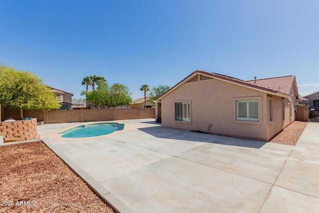 view of swimming pool with a fenced in pool, a fenced backyard, and a patio area