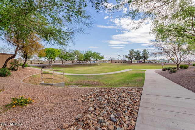 view of home's community with a lawn