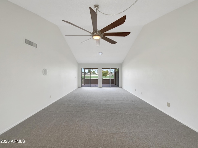 carpeted empty room with visible vents, high vaulted ceiling, and ceiling fan