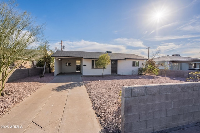 single story home featuring a carport